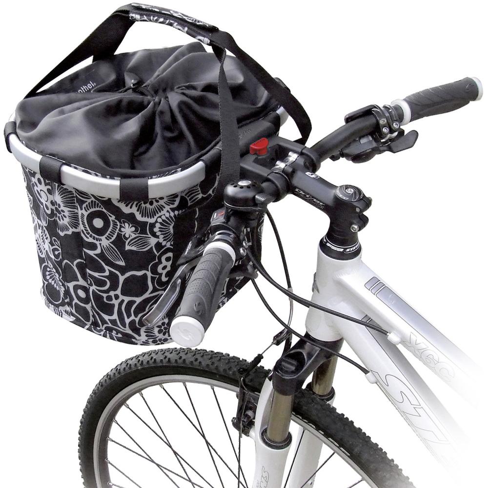 KLICKfix Reisenthel Fahrradkorb Bikebasket fleur schwarz 35x28x26 cm am Lenker eines weißen Fahrrads.