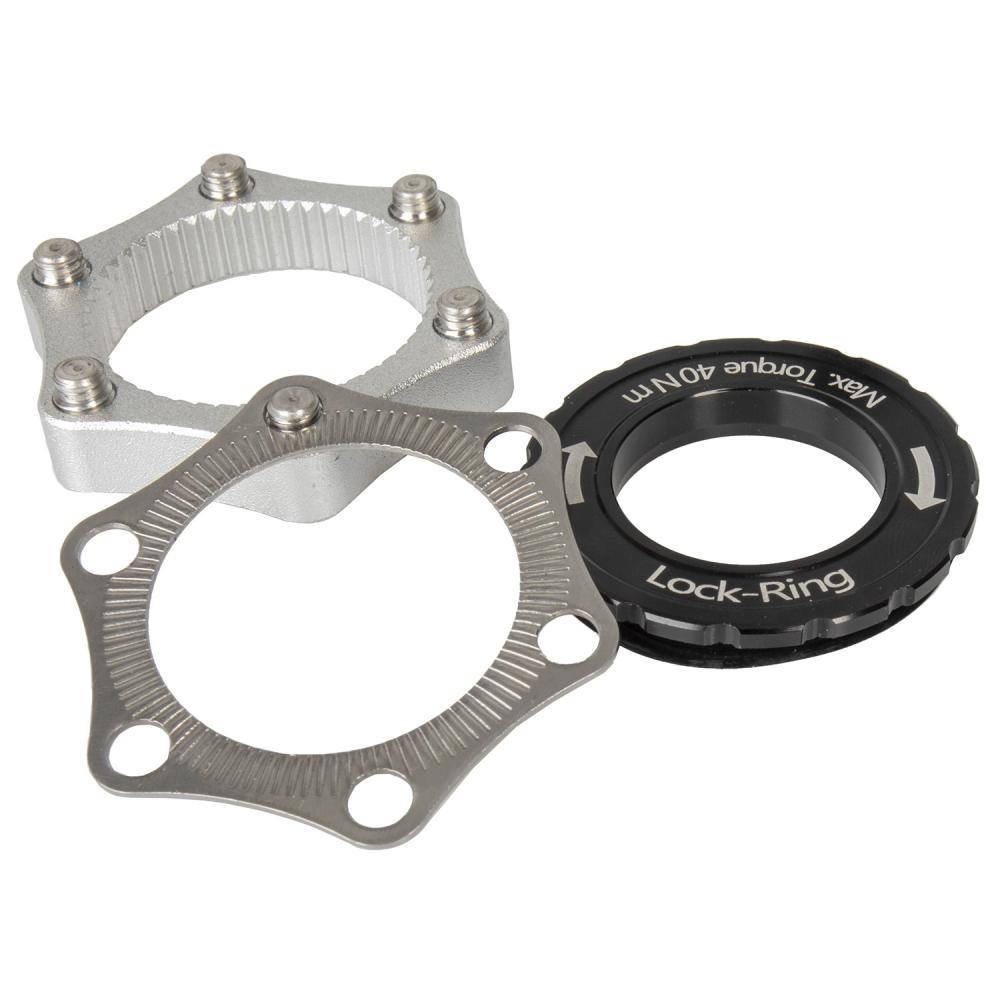 Messingschlager Centerlock Adapter ADA DB CL M-WAVE für Scheibenbremsen schwarz, mit silbernen Adaptern.