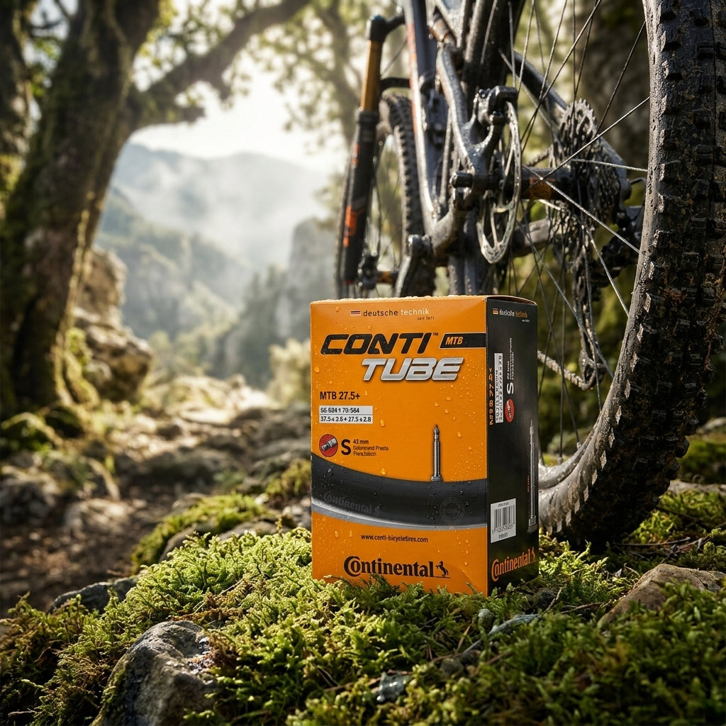 Continental Schlauch Conti MTB 27.5+ SV 42mm im Gelände mit Mountainbike und Naturlandschaft.