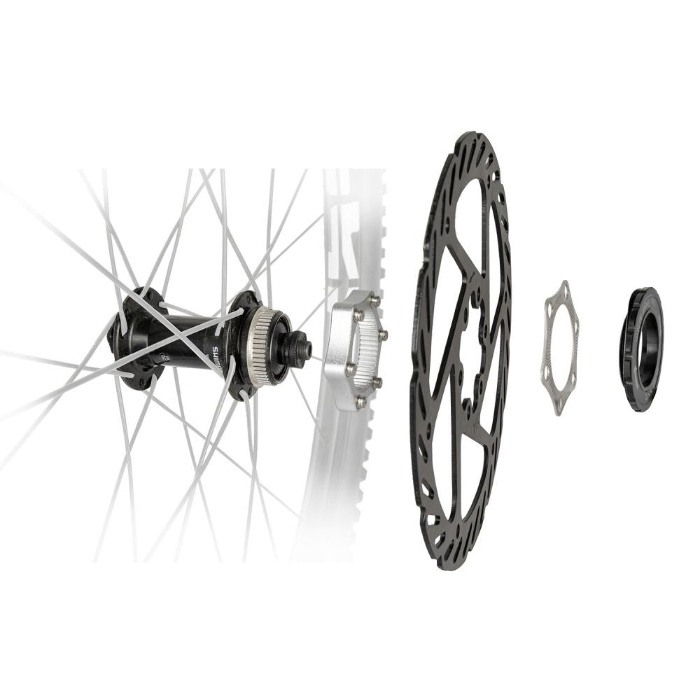 Messingschlager M-WAVE Centerlock Adapter für Fahrrad Scheibenbremse, Einbau mit Bremsscheibe und Verschlussring.