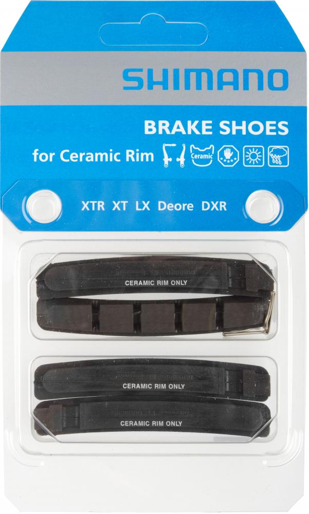 Shimano M70R2 Felgenbremsbeläge für V-Brake Keramikfelgen in blauer Verpackung für kontrollierte Bremsleistung.