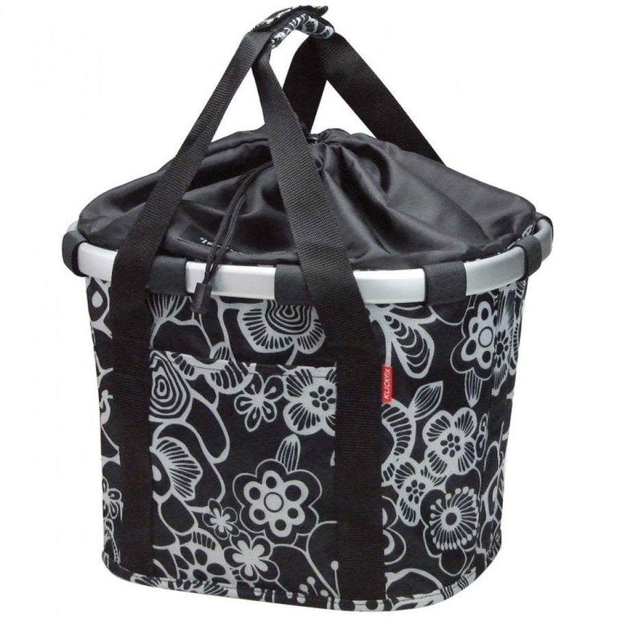 KLICKfix Reisenthel Fahrradkorb Bikebasket fleur schwarz mit weißem Blumenmuster und Zugverschluss.