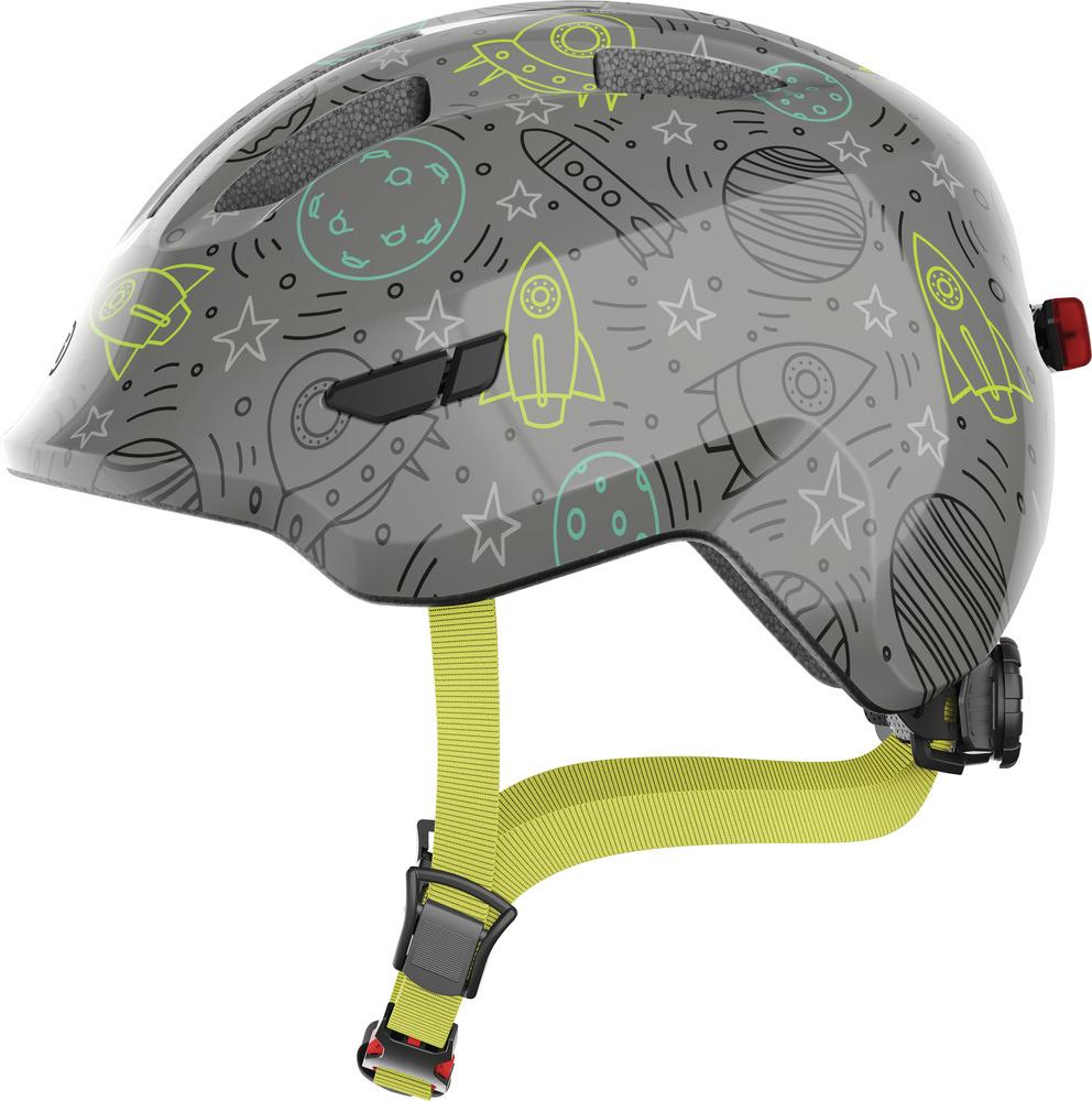 Abus Kinderhelm Smiley 3.0 LED grey space mit Raketen und Sternen, Größe S 45-50cm, gelbe Riemen, Seitenansicht.