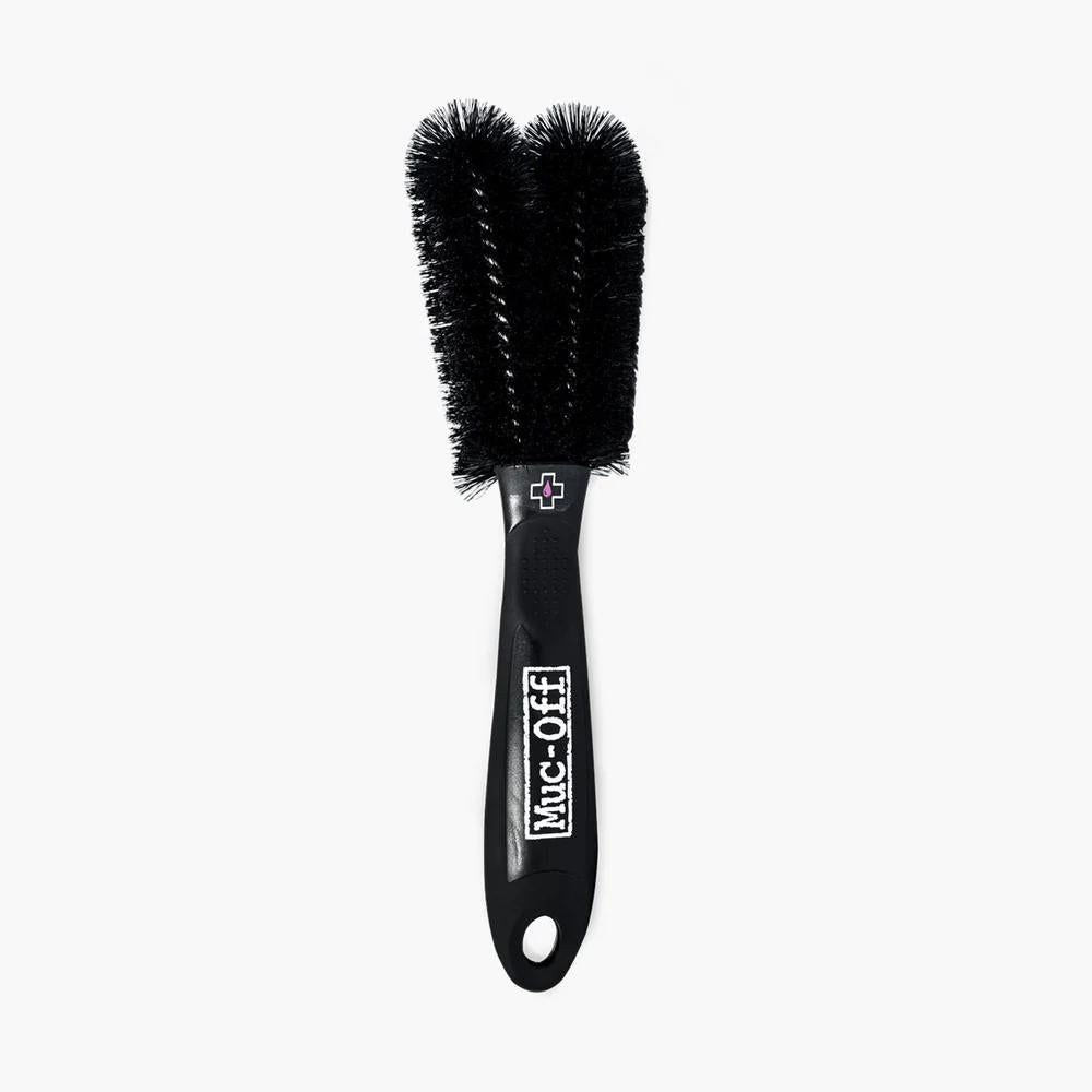 Schwarze Muc-Off Doppelbürste für Fahrradreinigung und -pflege, Teil des Pit Kit Reinigungssets.