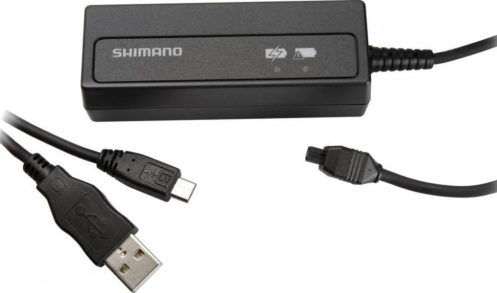 SHIMANO SM-BCR2 Di2 Ladegerät für interne Akkus. Schwarz mit USB- und Di2-Anschluss, Lade-LEDs.